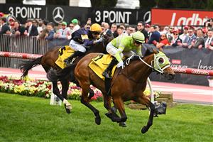 MELBOURNE, AUSTRALIA - OCTOBER 25: Jye McNeil riding Star of India winning Race 5, the Schweppes Jra Cup during Cox Plate Day at Moonee Valley Racecourse on October 25, 2025 in Melbourne, Australia. (Photo by Vince Caligiuri/Getty Images)