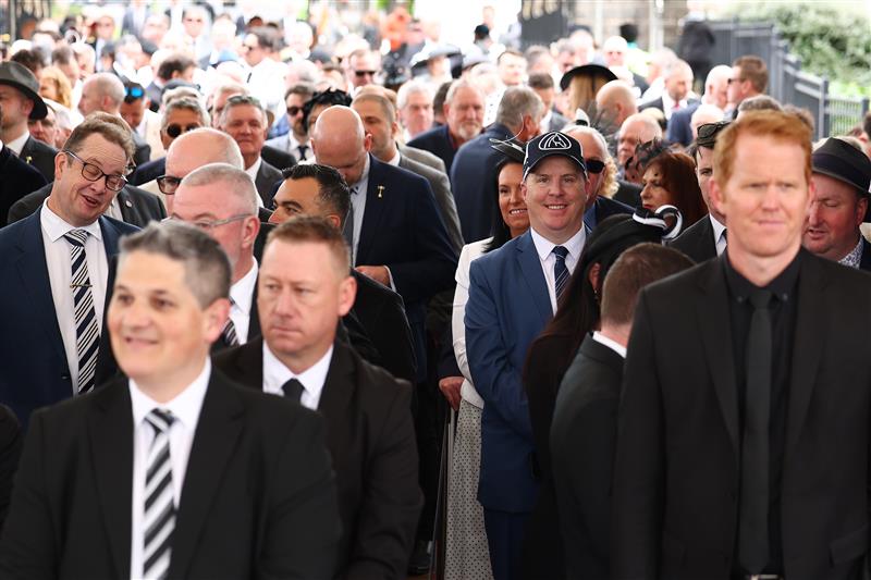 MELBOURNE, AUSTRALIA - NOVEMBER 01: Patrons prepare to enter through the gates ahead of Melbourne Racing at Flemington Racecourse on November 01, 2025 in Melbourne, Australia. (Photo by Morgan Hancock/Getty Images)