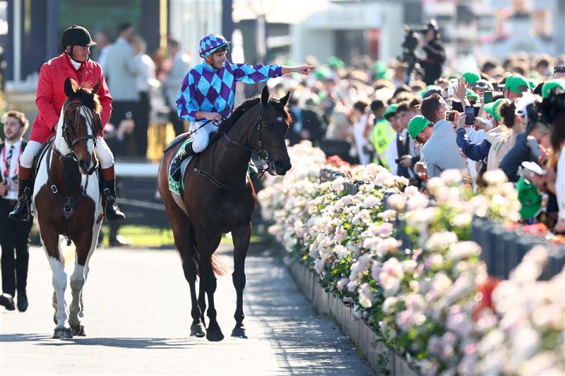 MELBOURNE, AUSTRALIA - NOVEMBER 01: Declan Bates celebrates after riding Pride of Jenni to win race eight the Tab Empire Rose Stakes during Melbourne Racing at Flemington Racecourse on November 01, 2025 in Melbourne, Australia. (Photo by Daniel Pockett/Getty Images)