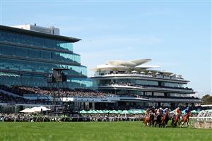 MELBOURNE, AUSTRALIA - NOVEMBER 01: A general view as jockeys ride horses around the first bend in Race 7 the Howden Victoria Derby during Melbourne Racing at Flemington Racecourse on November 01, 2025 in Melbourne, Australia. (Photo by Morgan Hancock/Getty Images)