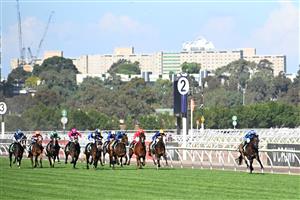 MELBOURNE, AUSTRALIA - NOVEMBER 01: Declan Bates riding Pride of Jenni winning Race 8, the Tab Empire Rose Stakes during 2025 Derby Day at Flemington Racecourse on November 01, 2025 in Melbourne, Australia. (Photo by Vince Caligiuri/Getty Images)