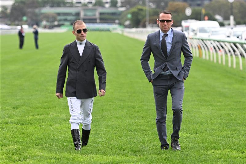 MELBOURNE, AUSTRALIA - NOVEMBER 04: Thore Hammer Hansen and trainer Henk Grewe walk the track during Melbourne Cup Day at Flemington Racecourse on November 04, 2025 in Melbourne, Australia. (Photo by Vince Caligiuri/Getty Images)