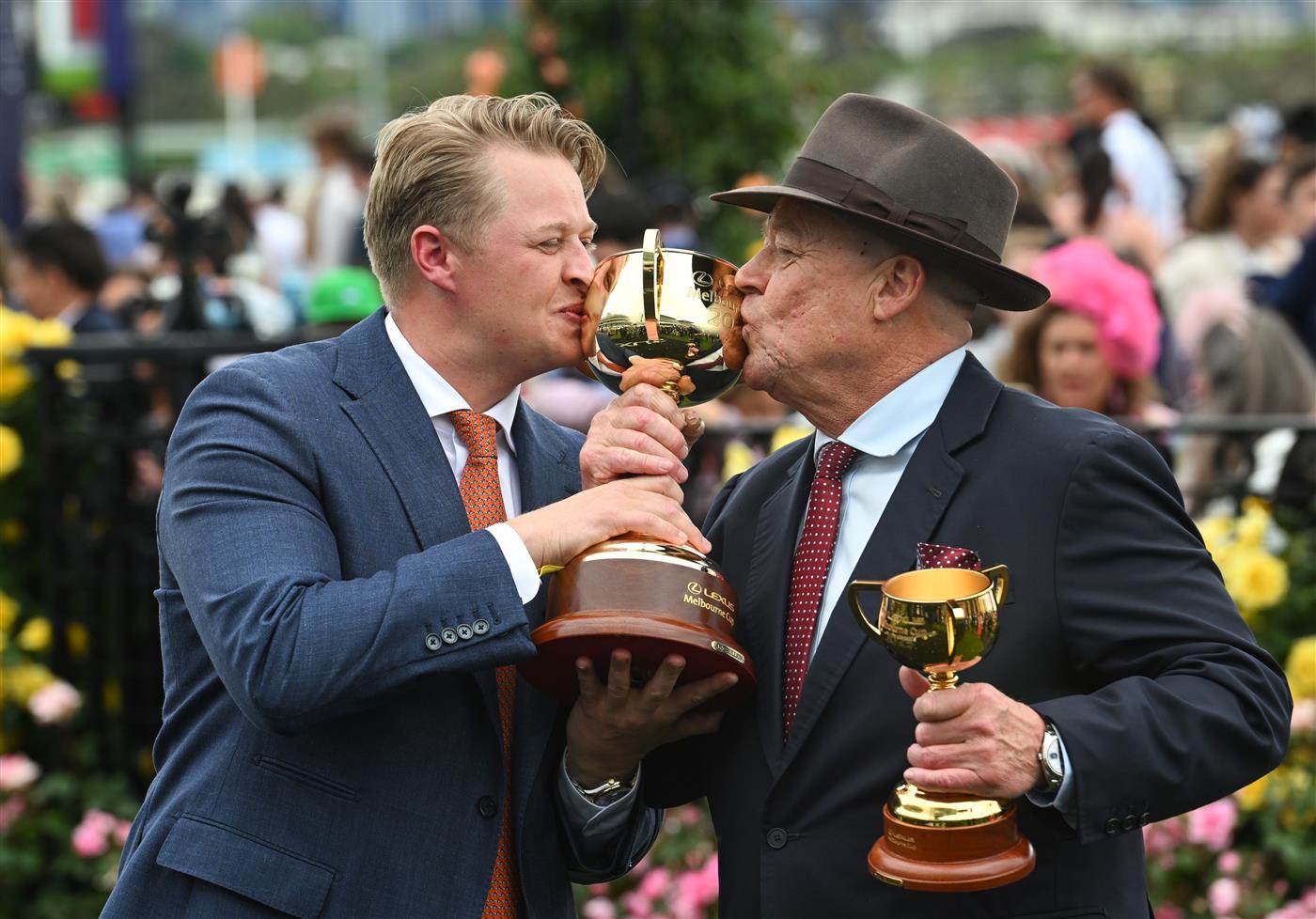 MELBOURNE, AUSTRALIA - NOVEMBER 04: Co trainers Tony McEvoy and Calvin McEvoy pose with trophy after Half Yours won Race 7, the Lexus Melbourne Cup during Melbourne Cup Day at Flemington Racecourse on November 04, 2025 in Melbourne, Australia. (Photo by Vince Caligiuri/Getty Images)