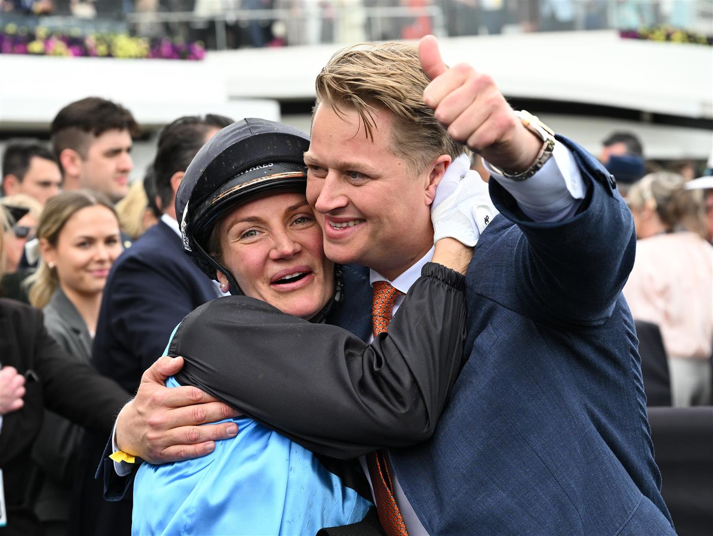 MELBOURNE, AUSTRALIA - NOVEMBER 04: Jamie Melham celebrates with co trainer Calvin McEvoy after riding Half Yours to win Race 7, the Lexus Melbourne Cup during Melbourne Cup Day at Flemington Racecourse on November 04, 2025 in Melbourne, Australia. (Photo by Vince Caligiuri/Getty Images)