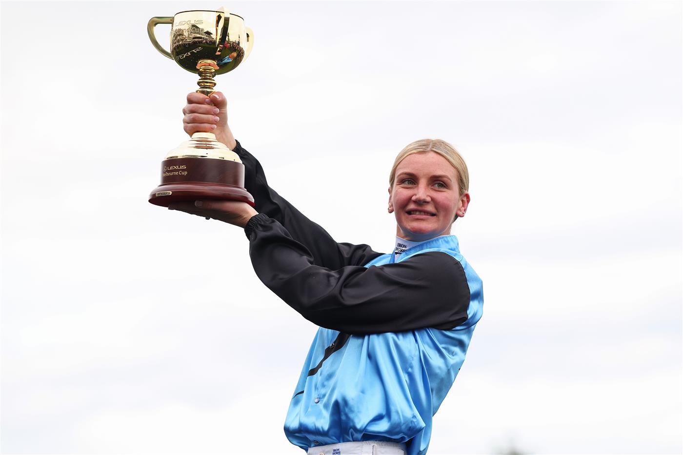MELBOURNE, AUSTRALIA - NOVEMBER 04: Jamie Melham raises the 2025 Lexus Melbourne Cup after riding Half Yours to win race seven the Lexus Melbourne Cup during Melbourne Cup Day at Flemington Racecourse on November 04, 2025 in Melbourne, Australia. (Photo by Daniel Pockett/Getty Images)