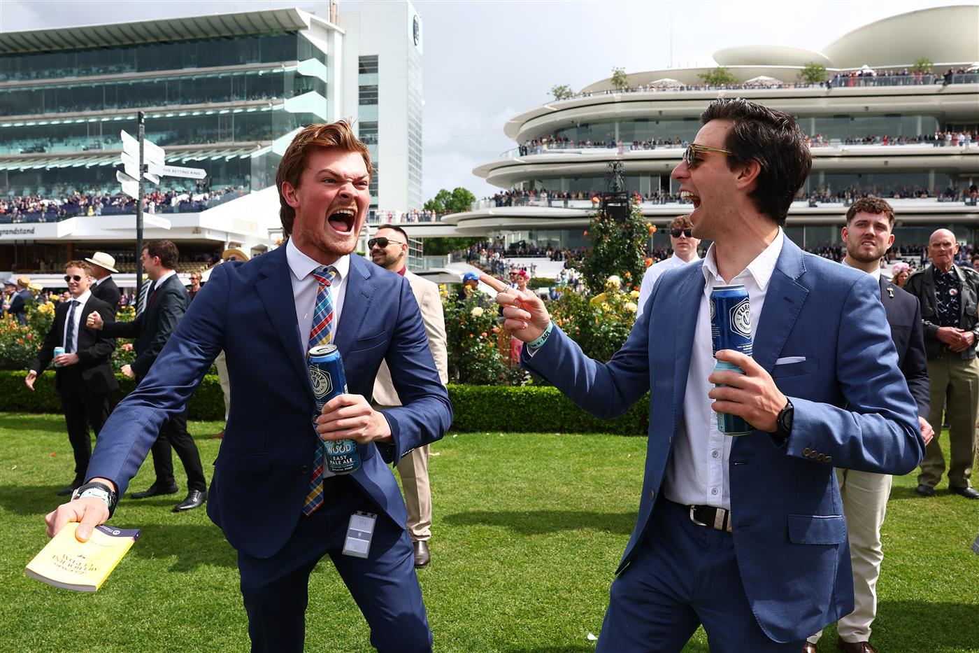 MELBOURNE, AUSTRALIA - NOVEMBER 04: Racegoers celebrate victory during Melbourne Cup Day at Flemington Racecourse on November 04, 2025 in Melbourne, Australia. (Photo by Morgan Hancock/Getty Images)