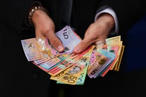 MELBOURNE, AUSTRALIA - NOVEMBER 04: A detail of money being held by a bookie is seen during Melbourne Cup Day at Flemington Racecourse on November 04, 2025 in Melbourne, Australia. (Photo by Daniel Pockett/Getty Images)
