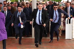 MELBOURNE, AUSTRALIA - NOVEMBER 04: Racegoers arrive during Melbourne Cup Day at Flemington Racecourse on November 04, 2025 in Melbourne, Australia. (Photo by Daniel Pockett/Getty Images)