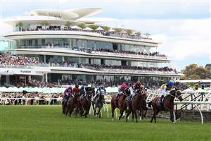 MELBOURNE, AUSTRALIA - NOVEMBER 04: The field run around the first bend in Race 5, the Australian Heritage Cup during Melbourne Cup Day at Flemington Racecourse on November 04, 2025 in Melbourne, Australia. (Photo by Daniel Pockett/Getty Images)