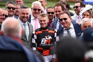 MELBOURNE, AUSTRALIA - NOVEMBER 04: Ethan Brown poses with connections after riding Tornado Valley to win Race 1, the Darley Maribyrnong Plate during Melbourne Cup Day at Flemington Racecourse on November 04, 2025 in Melbourne, Australia. (Photo by Daniel Pockett/Getty Images)