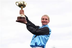 MELBOURNE, AUSTRALIA - NOVEMBER 04: Jamie Melham raises the 2025 Lexus Melbourne Cup after riding Half Yours to win race seven the Lexus Melbourne Cup during Melbourne Cup Day at Flemington Racecourse on November 04, 2025 in Melbourne, Australia. (Photo by Daniel Pockett/Getty Images)