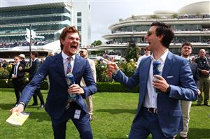 MELBOURNE, AUSTRALIA - NOVEMBER 04: Racegoers celebrate victory during Melbourne Cup Day at Flemington Racecourse on November 04, 2025 in Melbourne, Australia. (Photo by Morgan Hancock/Getty Images)