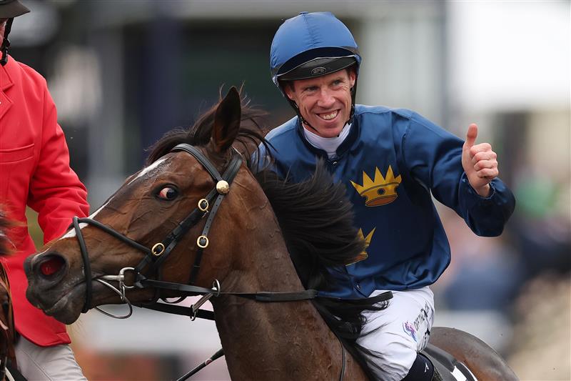 MELBOURNE, AUSTRALIA - NOVEMBER 06: John Allen celebrates after riding Strictly Business to win race eight the Crown Oaks during Oaks Day at Flemington Racecourse on November 06, 2025 in Melbourne, Australia. (Photo by Morgan Hancock/Getty Images)
