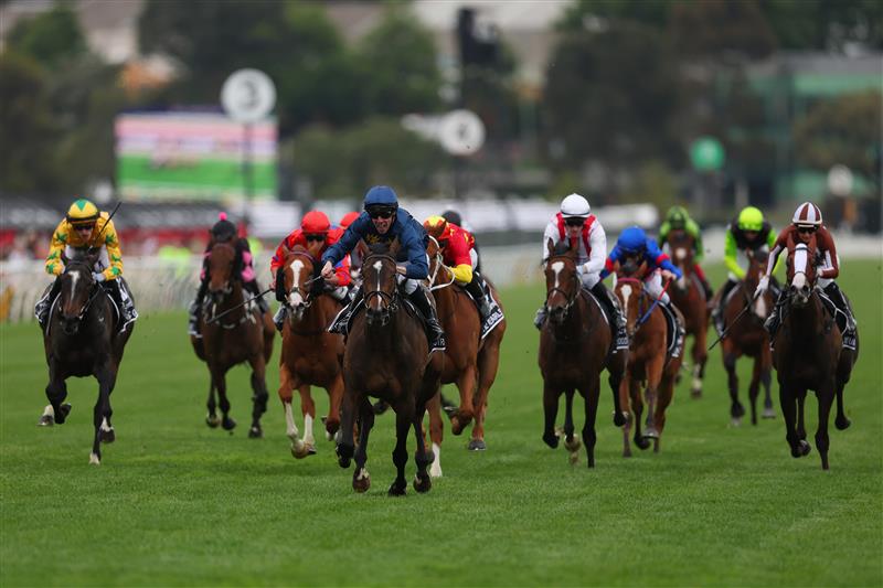 MELBOURNE, AUSTRALIA - NOVEMBER 06: John Allen rides Strictly Business to win race eight the Crown Oaks during Oaks Day at Flemington Racecourse on November 06, 2025 in Melbourne, Australia. (Photo by Morgan Hancock/Getty Images)