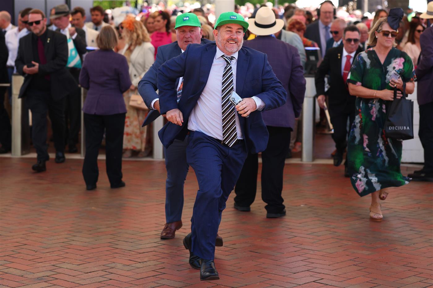MELBOURNE, AUSTRALIA - NOVEMBER 06: Race goers arrive during Oaks Day at Flemington Racecourse on November 06, 2025 in Melbourne, Australia. (Photo by Daniel Pockett/Getty Images)