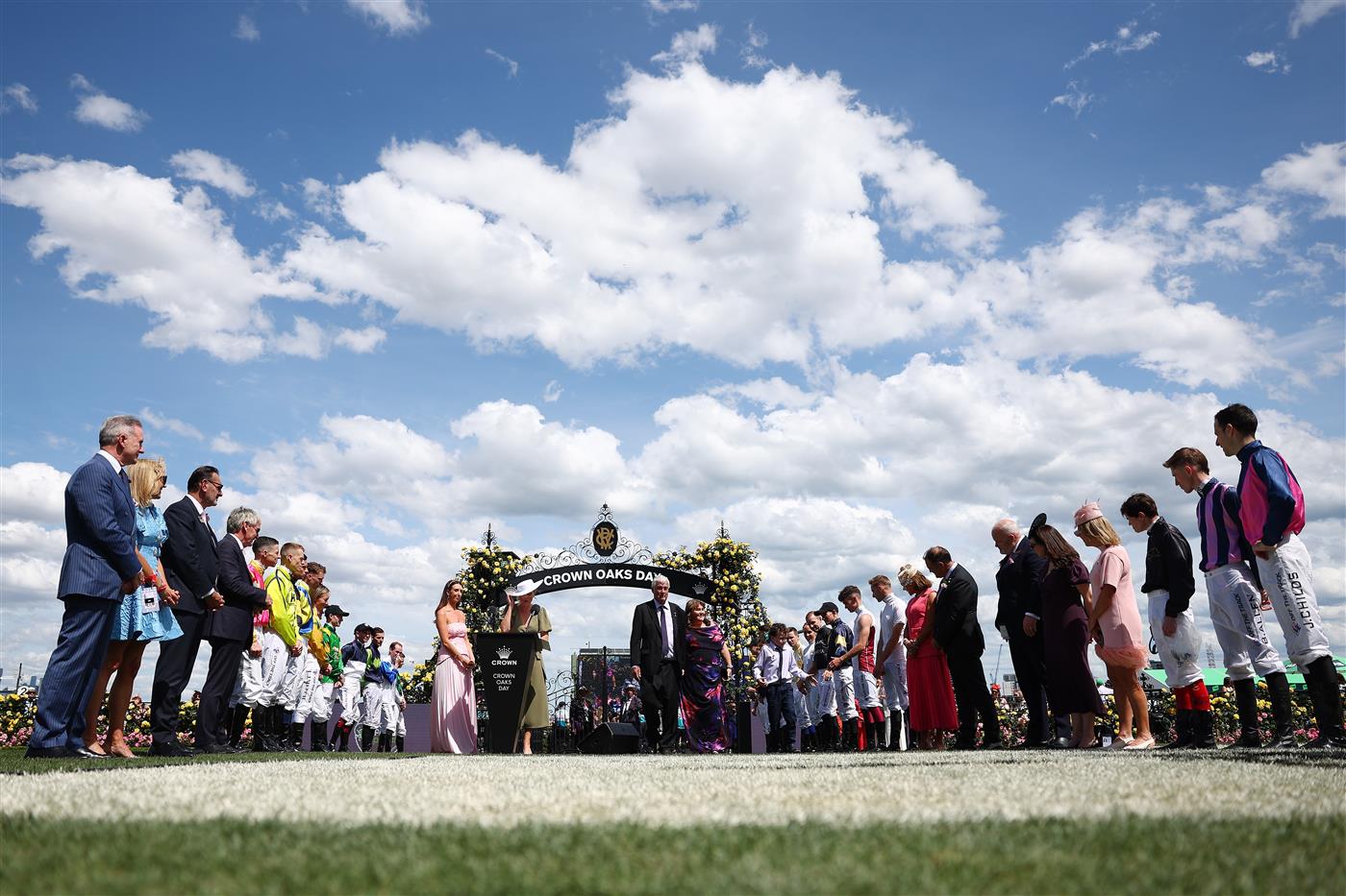 MELBOURNE, AUSTRALIA - NOVEMBER 06: Jockeys form a guard of honour for children and their families after the running of Race Four the Good Friday Appeal Trophy during Melbourne Racing at Flemington Racecourse on November 06, 2025 in Melbourne, Australia. (Photo by Morgan Hancock/Getty Images)