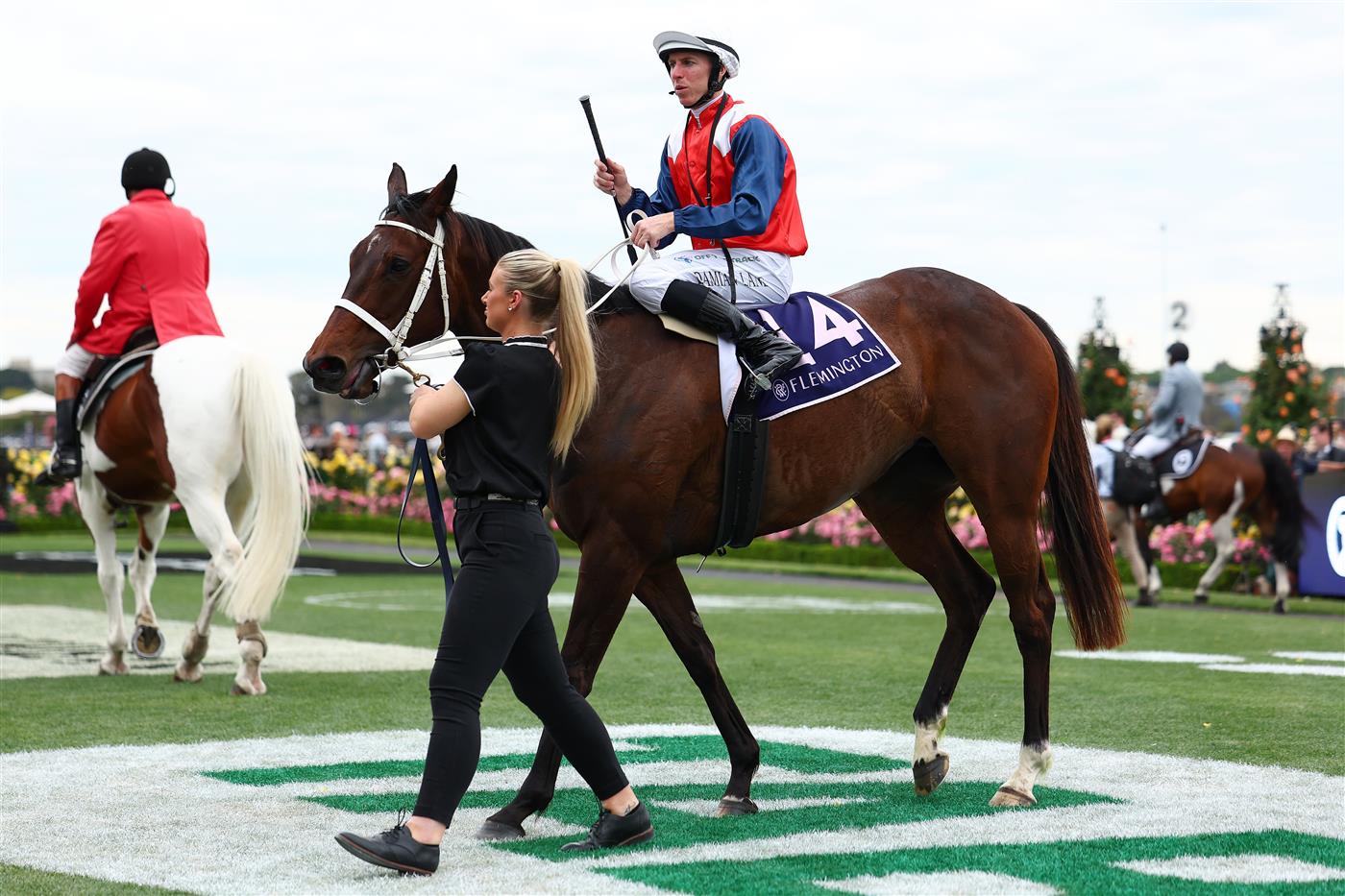 MELBOURNE, AUSTRALIA - NOVEMBER 06: Damian Lane celebrates riding Stokke to win race nine the NYE at Flemington Century Stakes during Oaks Day at Flemington Racecourse on November 06, 2025 in Melbourne, Australia (Photo by Morgan Hancock/Getty Images)