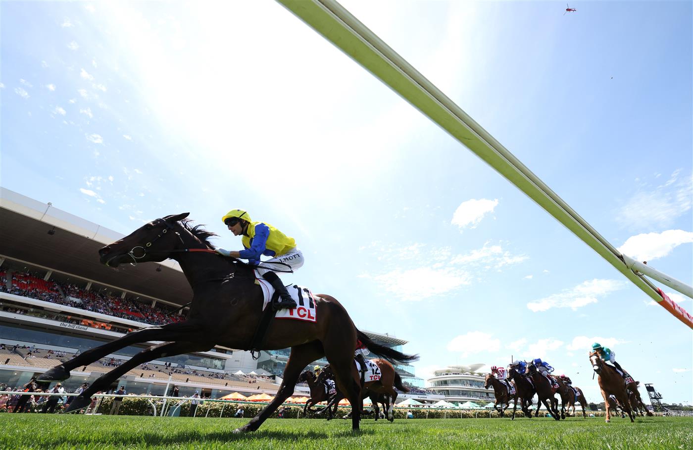 MELBOURNE, AUSTRALIA - NOVEMBER 06: Jamie Mott rides #11 First Chorus to win race one the TCL Trophy during Oaks Day at Flemington Racecourse on November 06, 2025 in Melbourne, Australia. (Photo by Robert Cianflone/Getty Images)