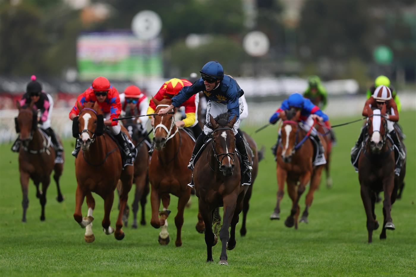 MELBOURNE, AUSTRALIA - NOVEMBER 06: John Allen rides Strictly Business to win race eight the Crown Oaks during Oaks Day at Flemington Racecourse on November 06, 2025 in Melbourne, Australia. (Photo by Morgan Hancock/Getty Images)