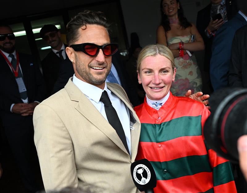 MELBOURNE, AUSTRALIA - NOVEMBER 08: Jamie Melham poses with Dj and music producer, Fisher after winning Race 3, the Fisher Stakes   during Champions Day at Flemington Racecourse on November 08, 2025 in Melbourne, Australia. (Photo by Vince Caligiuri/Getty Images)