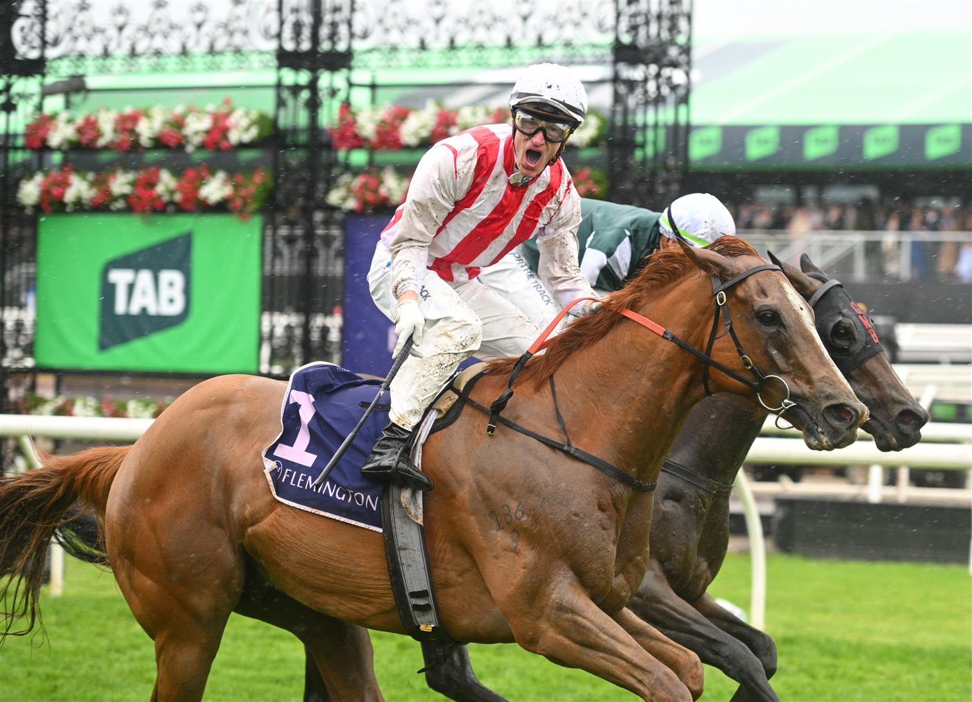 MELBOURNE, AUSTRALIA - NOVEMBER 08: Mark Zahra riding Giga Kick defeats Michael Dee riding Magic Time in Race 6, the Vrc Champions Sprint during Champions Day at Flemington Racecourse on November 08, 2025 in Melbourne, Australia. (Photo by Vince Caligiuri/Getty Images)