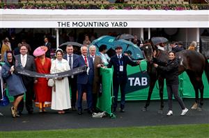 MELBOURNE, AUSTRALIA - NOVEMBER 08: Connections of Grand Larceny pose after Ben Melham rode Grand Larceny to win Race 9, the HKJC World Pool Grand Handicap during Champions Day at Flemington Racecourse on November 08, 2025 in Melbourne, Australia. (Photo by Josh Chadwick/Getty Images)