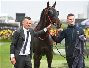 MELBOURNE, AUSTRALIA - NOVEMBER 08: Joe Pride and son Brave Pride pose with Ceolwulf after winning Race 7, the Lexus Champions Mile during Champions Day at Flemington Racecourse on November 08, 2025 in Melbourne, Australia. (Photo by Vince Caligiuri/Getty Images)