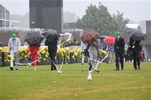 MELBOURNE, AUSTRALIA - NOVEMBER 08: General view of racegoers in the rain during Champions Day at Flemington Racecourse on November 08, 2025 in Melbourne, Australia. (Photo by Vince Caligiuri/Getty Images)