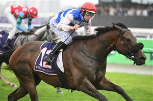 MELBOURNE, AUSTRALIA - NOVEMBER 08: Damian Lane riding Whisky on The Hill winning Race 5, the Queen Elizabeth Stakes  during Champions Day at Flemington Racecourse on November 08, 2025 in Melbourne, Australia. (Photo by Vince Caligiuri/Getty Images)