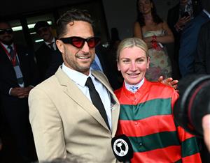 MELBOURNE, AUSTRALIA - NOVEMBER 08: Jamie Melham poses with Dj and music producer, Fisher after winning Race 3, the Fisher Stakes   during Champions Day at Flemington Racecourse on November 08, 2025 in Melbourne, Australia. (Photo by Vince Caligiuri/Getty Images)
