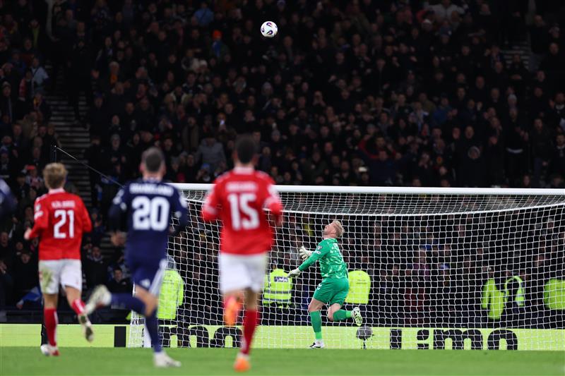 Kenny McLean lobs Kasper Schmeichel to make it 4-2 (Getty Images)