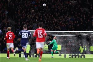 Kenny McLean lobs Kasper Schmeichel to make it 4-2 (Getty Images)