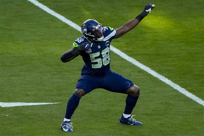 SANTA CLARA, CALIFORNIA - FEBRUARY 08: Derick Hall #58 of the Seattle Seahawks reacts after a sack against the New England Patriots during the first quarter Super Bowl LX at Levi