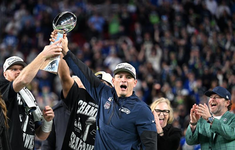Seattle Seahawks celebrate with the Vince Lombardi Trophy after winning Super Bowl LX against the New England Patriots