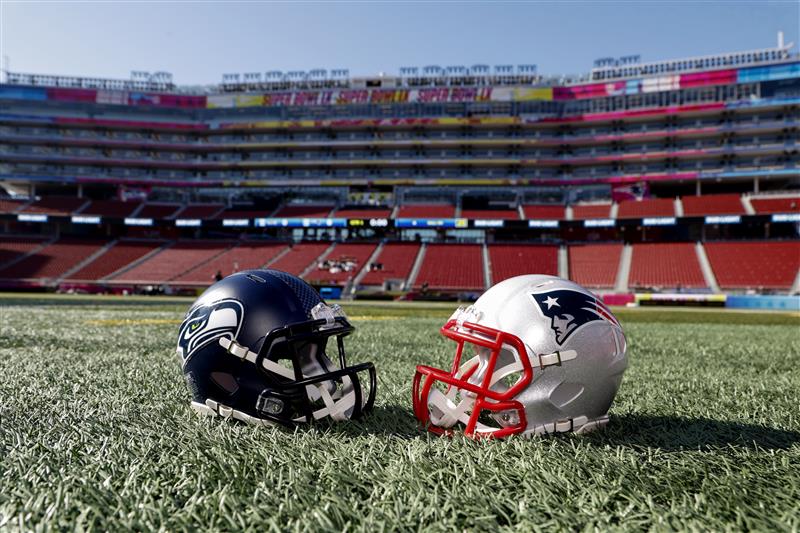 SANTA CLARA, CALIFORNIA- FEBRUARY 4: A general view of the Seattle Seahawks helmet and New England Patriots helmet displayed in inside of the Levi