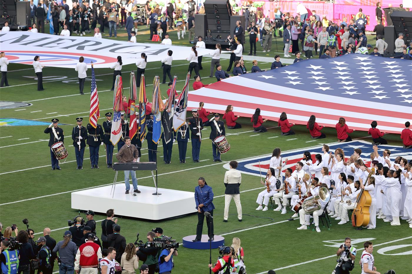 SANTA CLARA, CALIFORNIA - FEBRUARY 08: Charlie Puth performs the National Anthem during Super Bowl LX at Levi