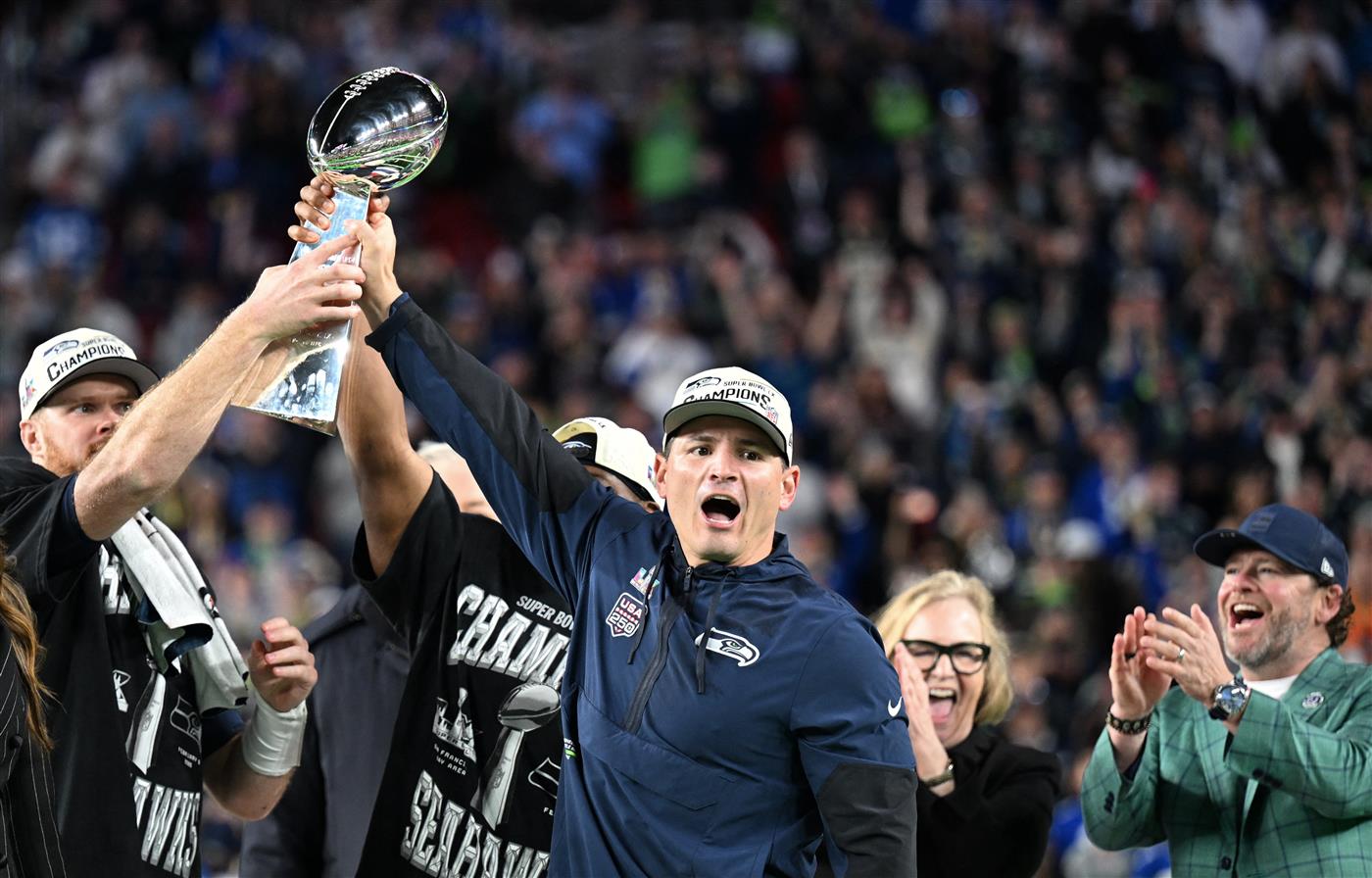 Seattle Seahawks celebrate with the Vince Lombardi Trophy after winning Super Bowl LX against the New England Patriots