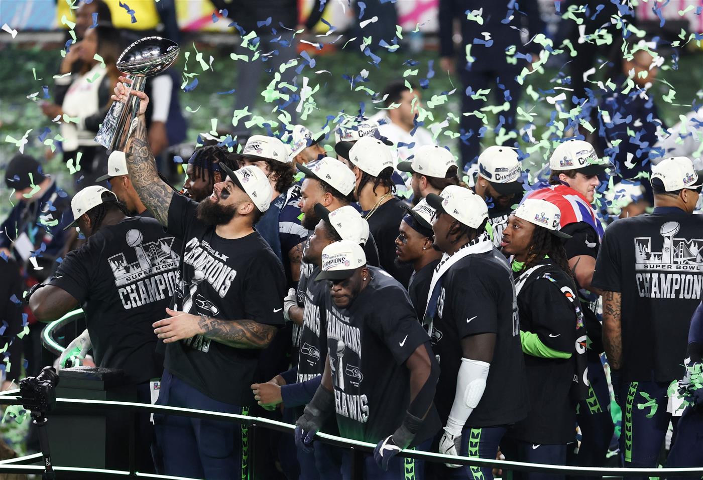 Seattle Seahawks celebrate with the Vince Lombardi Trophy after winning Super Bowl LX against the New England Patriots