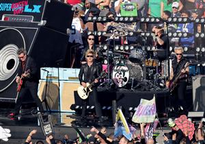 SANTA CLARA, CALIFORNIA - FEBRUARY 08: (L-R) Billie Joe Armstrong, Tré Cool and Mike Dirnt of Green Day perform during Super Bowl LX at Levi