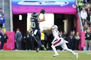 SANTA CLARA, CALIFORNIA - FEBRUARY 8: Cooper Kupp #10 of the Seattle Seahawks makes a catch in front of Marcus Jones #25 of the New England Patriots during the second quarter of the NFL Super Bowl LX football game, at Levi