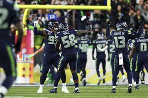 SANTA CLARA, CALIFORNIA - FEBRUARY 8: Derick Hall #58 of the Seattle Seahawks celebrates after forcing a fumble during the third quarter of the NFL Super Bowl LX football game against the New England Patriots, at Levi