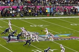 SANTA CLARA, CALIFORNIA - FEBRUARY 08: Drake Maye #10 of the New England Patriots takes the snap against the Seattle Seahawks during the third quarter in Super Bowl LX at Levi