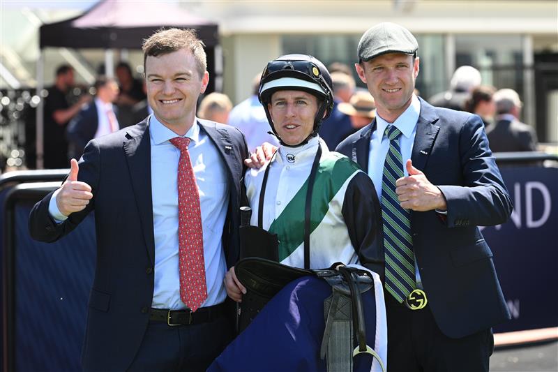 MELBOURNE, AUSTRALIA - FEBRUARY 14: Damian Lane poses with Ben Hayes and JD Hayes after riding Hard Kick to win Race 1, theTab Talindert Stakes during Melbourne Racing at Flemington Racecourse on February 14, 2026 in Melbourne, Australia. (Photo by Vince Caligiuri/Getty Images)
