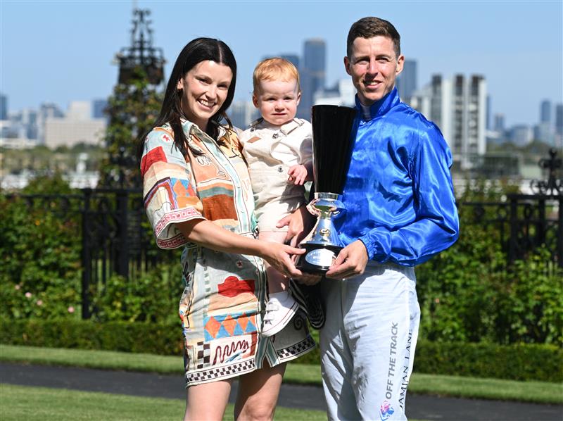 MELBOURNE, AUSTRALIA - FEBRUARY 14: Damian Lane poses with Bonnie Lane and son Charlie after riding Tentyris to win Race 8, the Black Caviar Lightning  during Melbourne Racing at Flemington Racecourse on February 14, 2026 in Melbourne, Australia. (Photo by Vince Caligiuri/Getty Images)