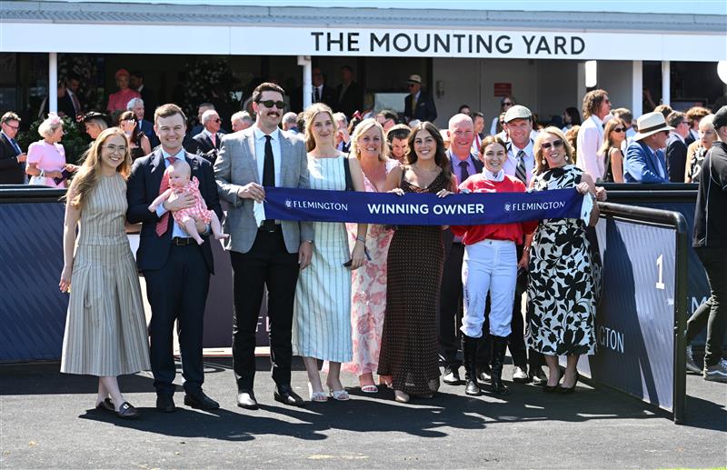 MELBOURNE, AUSTRALIA - FEBRUARY 14: Grace Ramage and Ben Hayes pose with daughter Indiana after Cafe Millenium won Race 7, the The Elms Handicap during Melbourne Racing at Flemington Racecourse on February 14, 2026 in Melbourne, Australia. (Photo by Vince Caligiuri/Getty Images)