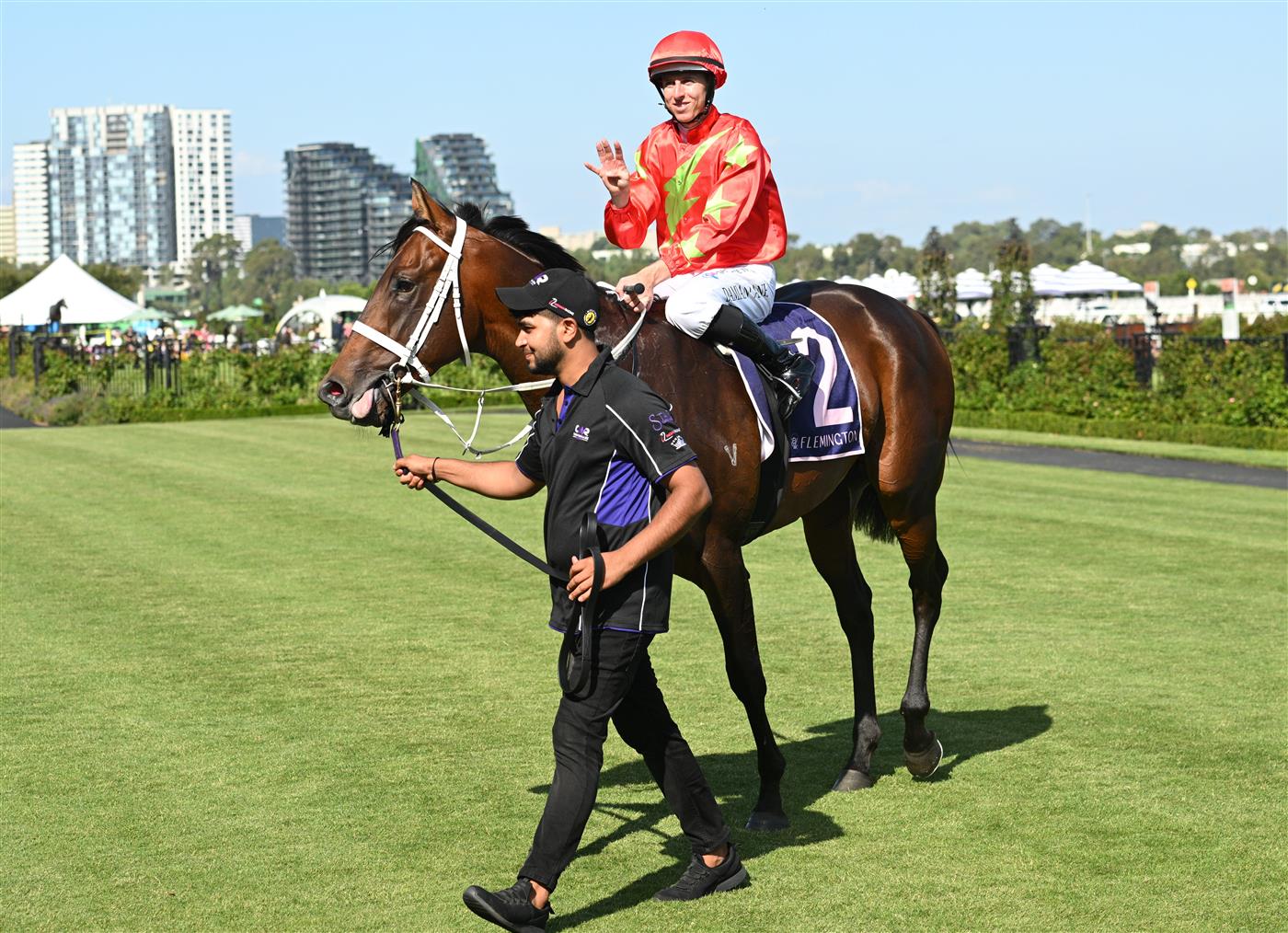 MELBOURNE, AUSTRALIA - FEBRUARY 14: Damian Lane brings up win number four after riding Sixties to win Race 9, the Cs Hayes Stakes during Melbourne Racing at Flemington Racecourse on February 14, 2026 in Melbourne, Australia. (Photo by Vince Caligiuri/Getty Images)