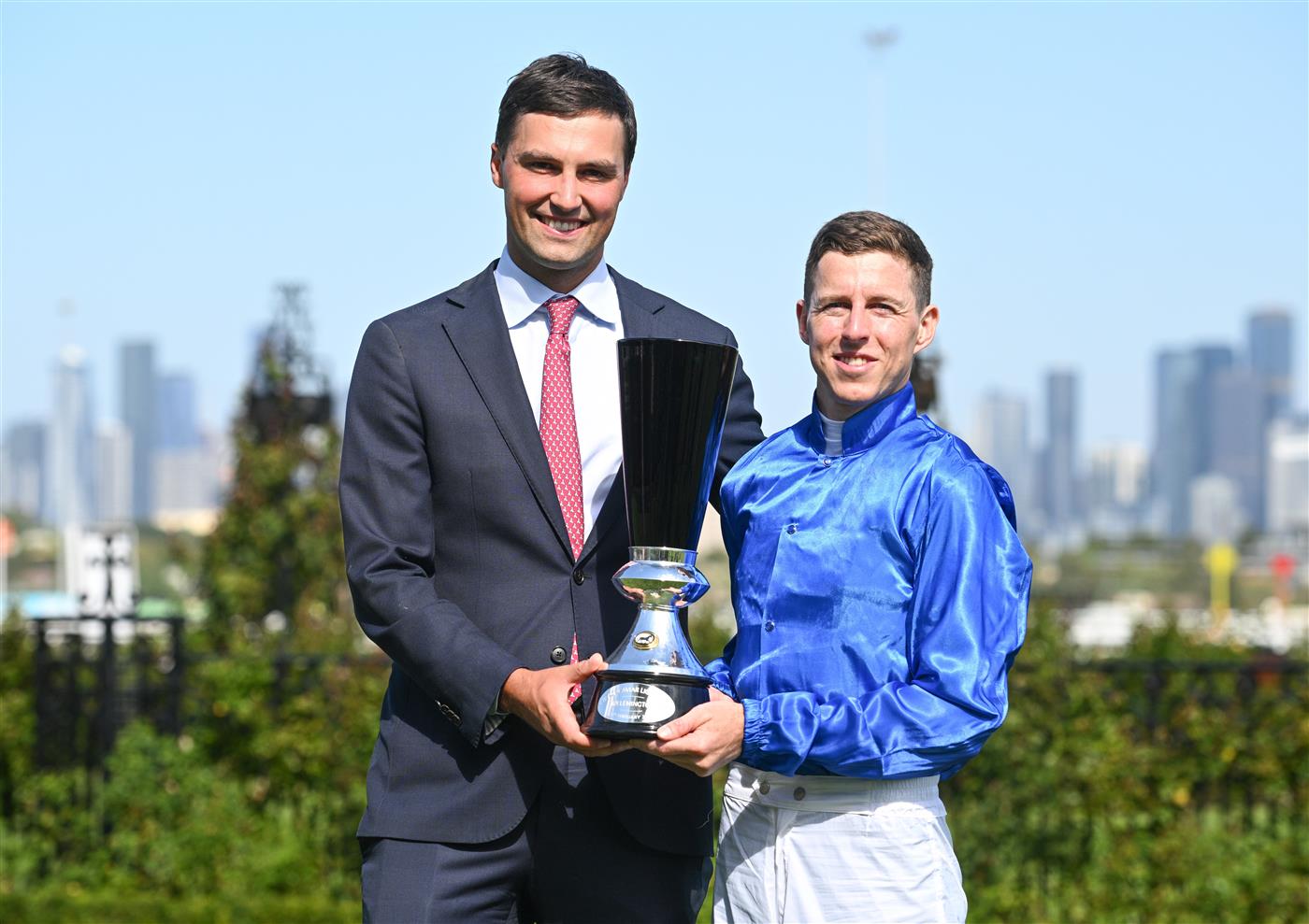 MELBOURNE, AUSTRALIA - FEBRUARY 14: Damian Lane poses with trainer Sam Freedman after riding Tentyris to win Race 8, the Black Caviar Lightning  during Melbourne Racing at Flemington Racecourse on February 14, 2026 in Melbourne, Australia. (Photo by Vince Caligiuri/Getty Images)