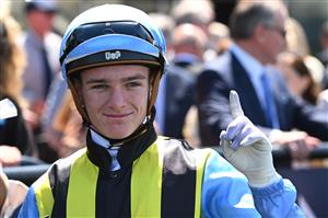 MELBOURNE, AUSTRALIA - FEBRUARY 14: Luke Cartwright riding Tarvue after winning Race 2, the Tab We