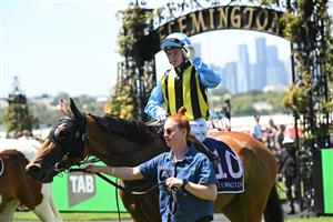 MELBOURNE, AUSTRALIA - FEBRUARY 14: Luke Cartwright riding Tarvue after winning Race 2, the Tab We