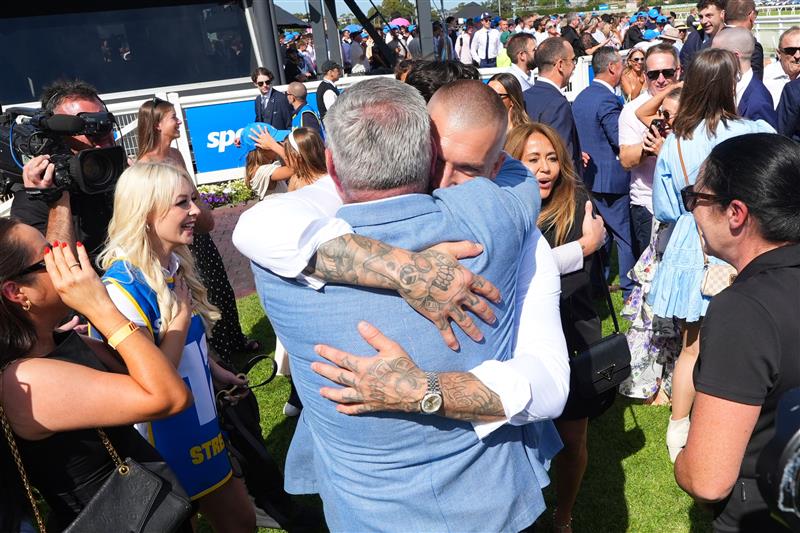 MELBOURNE, AUSTRALIA - FEBRUARY 21: Trainer Clinton McDonald hugs part owner and ex Richmond champion, Dustin Martin after Streisand won Race 8, the Sportsbet Blue Diamond Stakes during Melbourne Racing at Caulfield Racecourse on February 21, 2026 in Melbourne, Australia. (Photo by Vince Caligiuri/Getty Images)